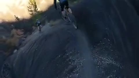 Bicyclists go on Thrilling Ride Along Narrow Mountain Peak