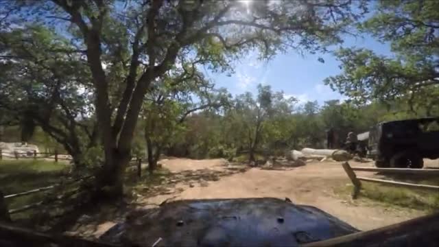 Jeep and dirtbike on mountain road