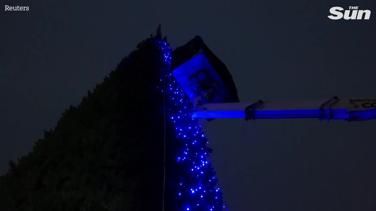 Ukrainians visit wartime Christmas tree installed in downtown Kyiv