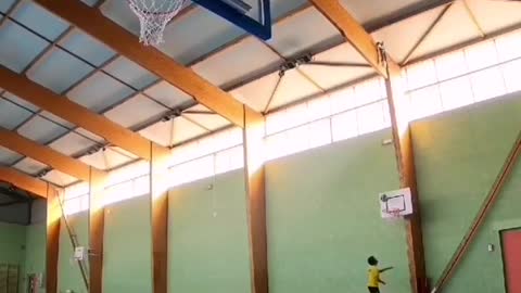 Man Performs Impressive Basketball Shots By Throwing Ball Through Multiple Hoops