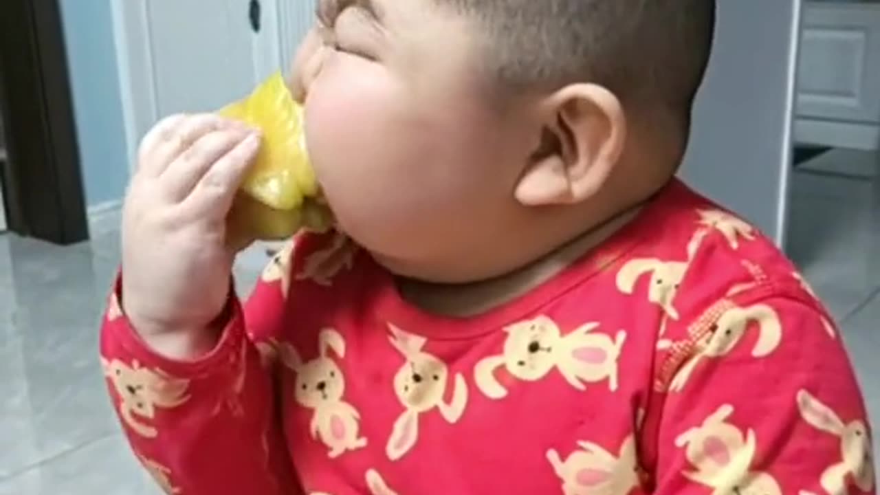 chinese boy eating fruit