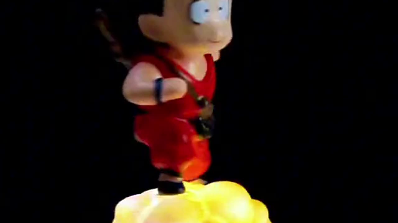 Son Gokou on flying nimbus levitating figure