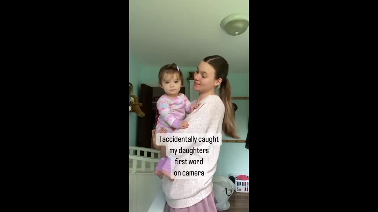 Mom unintentionally records the infant's first word on camera