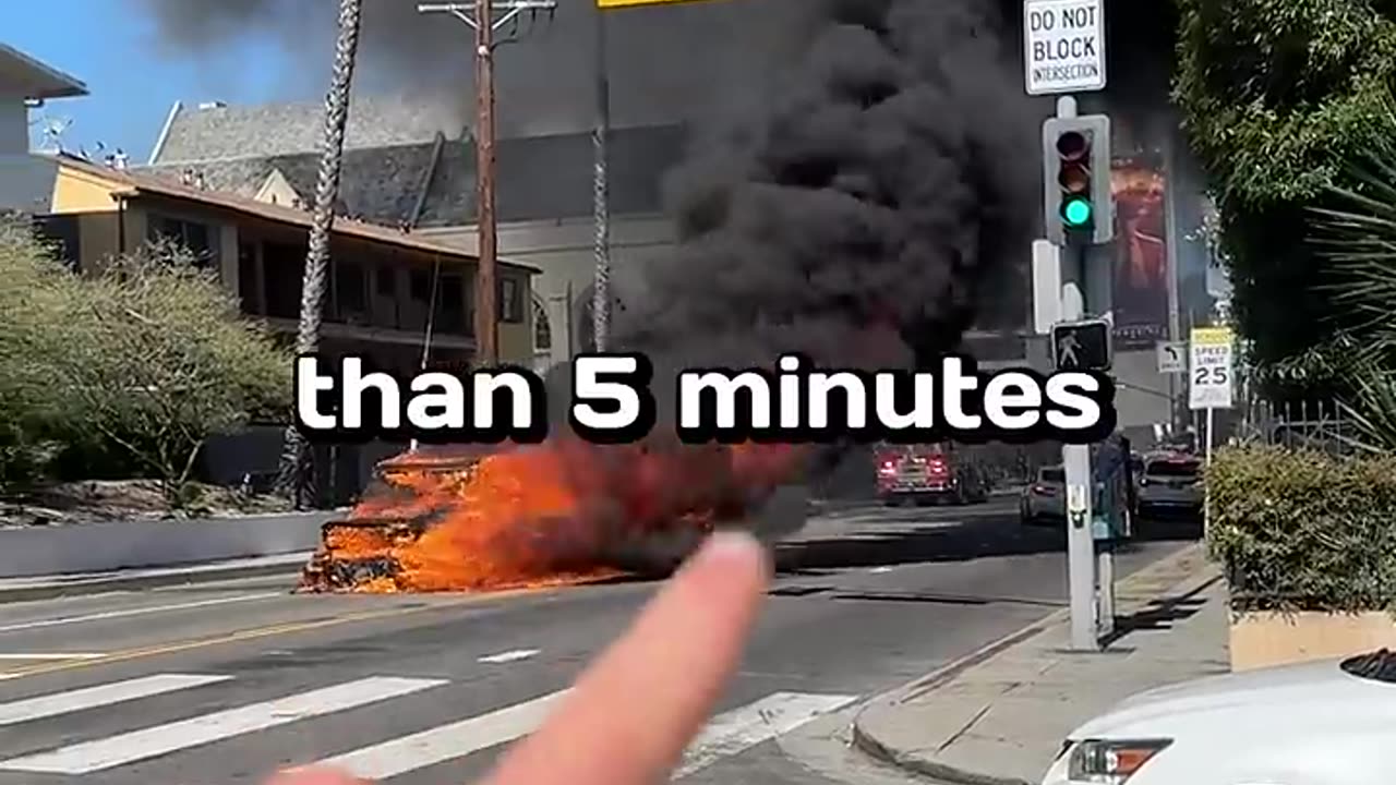 A Car Is Burning On The Street