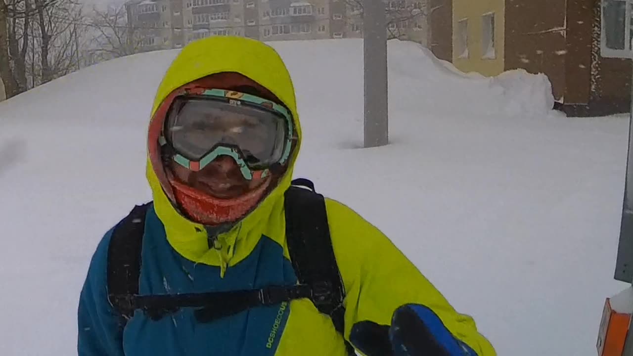 Man Crosses the Street During an Intense Blizzard