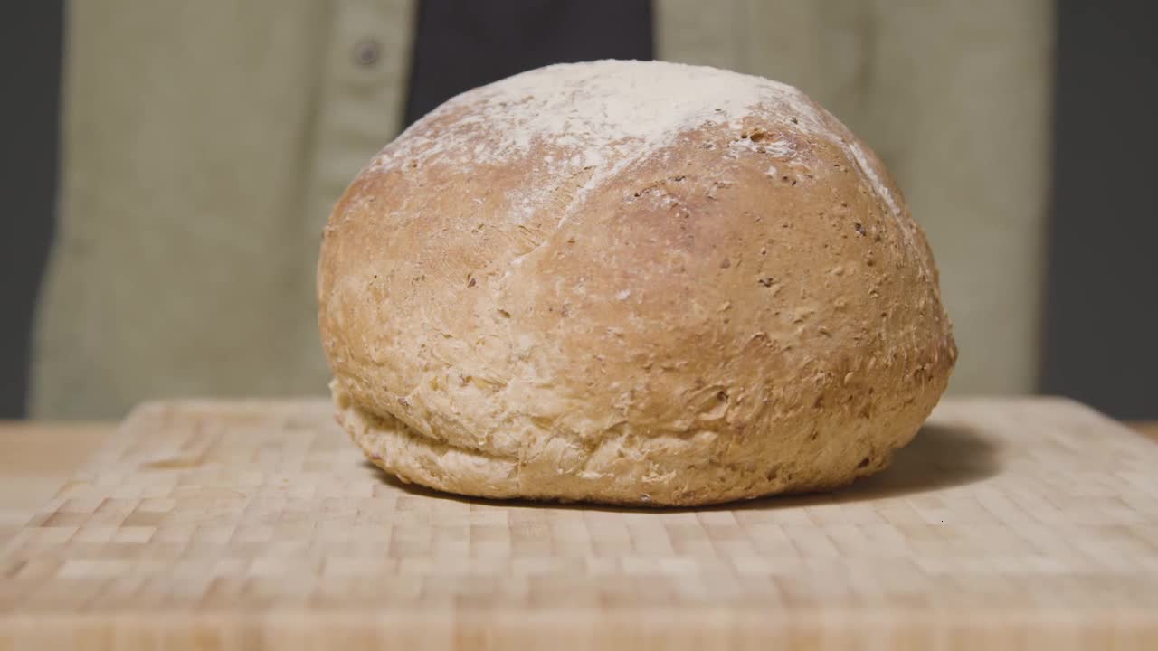 Tracking Shot of Loaf of Bread on Kitchen Workspace