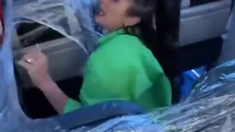 A woman purchased 3 economy seats on a plane and wrapped them