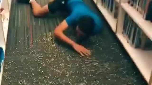 Friends Prank Guy by Tripping Him in Library