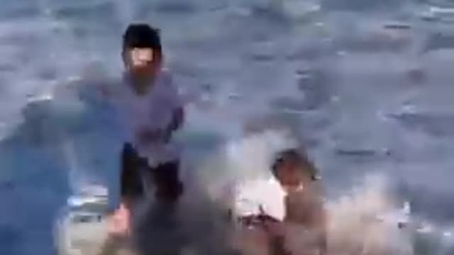 Toddlers Get Hit by Wave While Attempting to Build Sand Castle on Beach