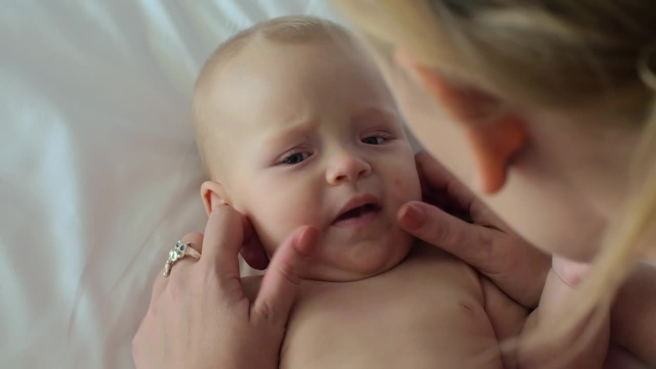 Mother playing with her infant