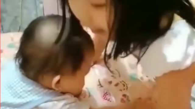 Baby is playing with her sister.