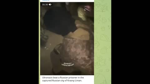 Kiev regime captors tortures an enemy captive.