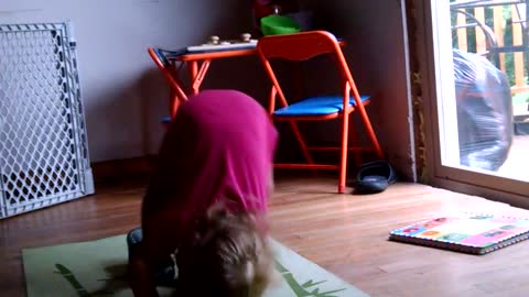 Toddler puts incredible effort into somersaults