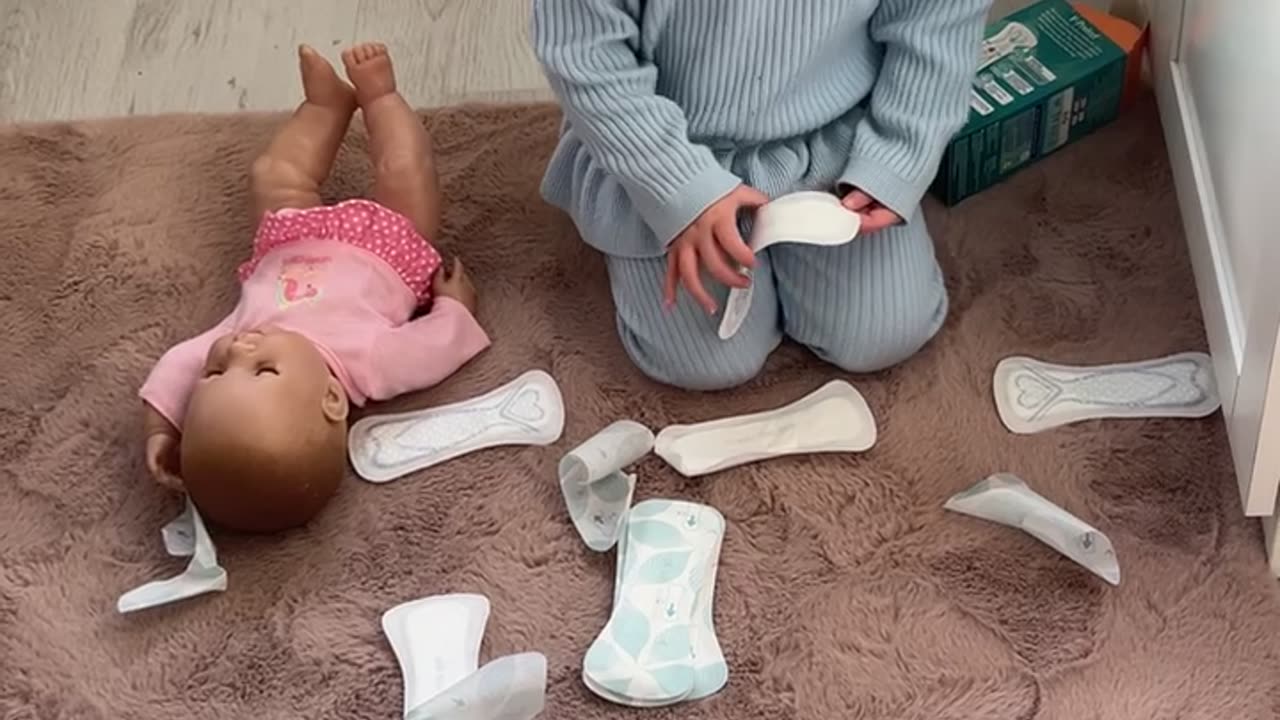 Toddler Plays With Pads