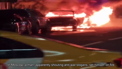 In Moscow, a man apparently shouting anti-war slogans set cars on fire