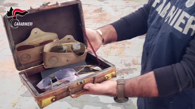 Sunglasses, champagne in mafia boss' family home