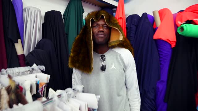 Terrell Owens shops fabrics for new clothing line