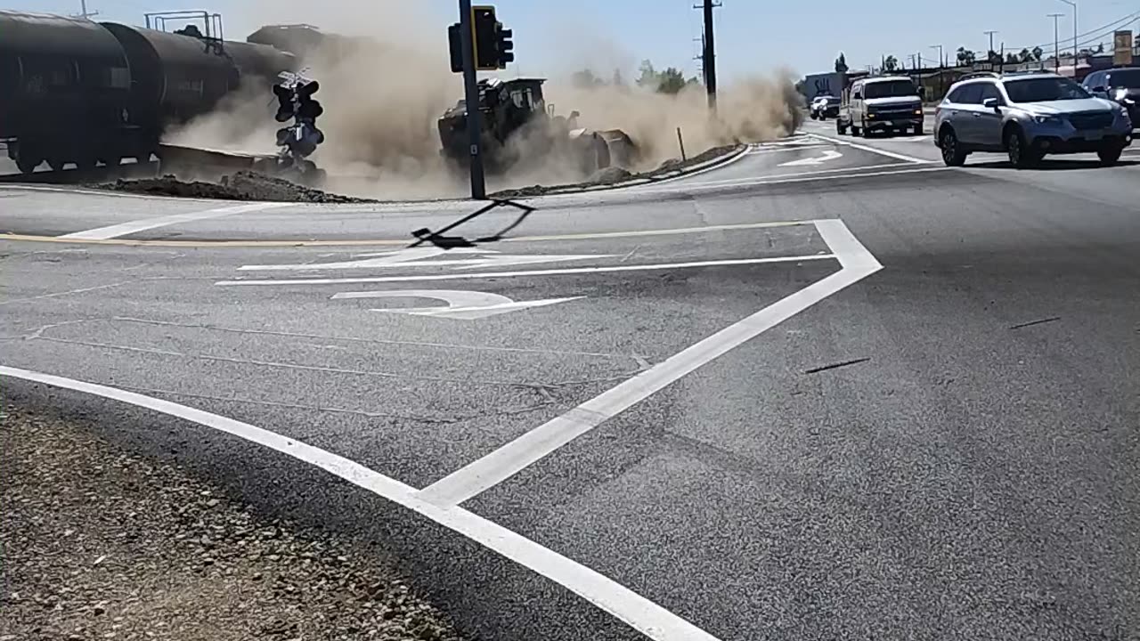 Train Collides With Stuck Semi-Truck's Trailer