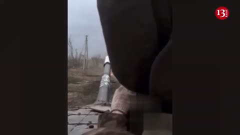 Russians watch how their leading tank hits a mine and burns