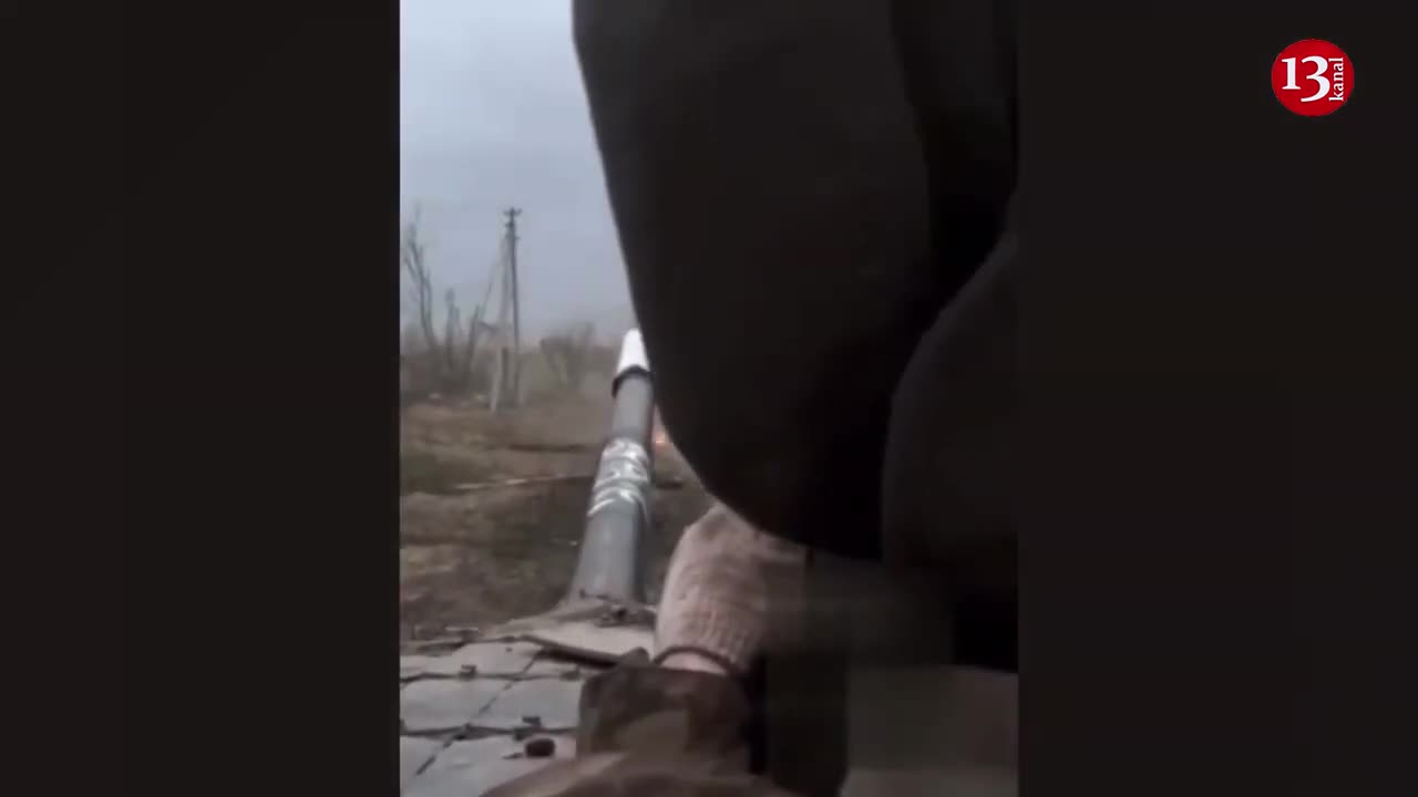 Russians watch how their leading tank hits a mine and burns