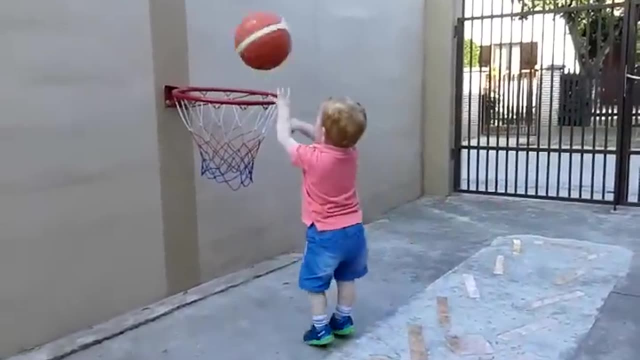 Cute Baby playing basketball