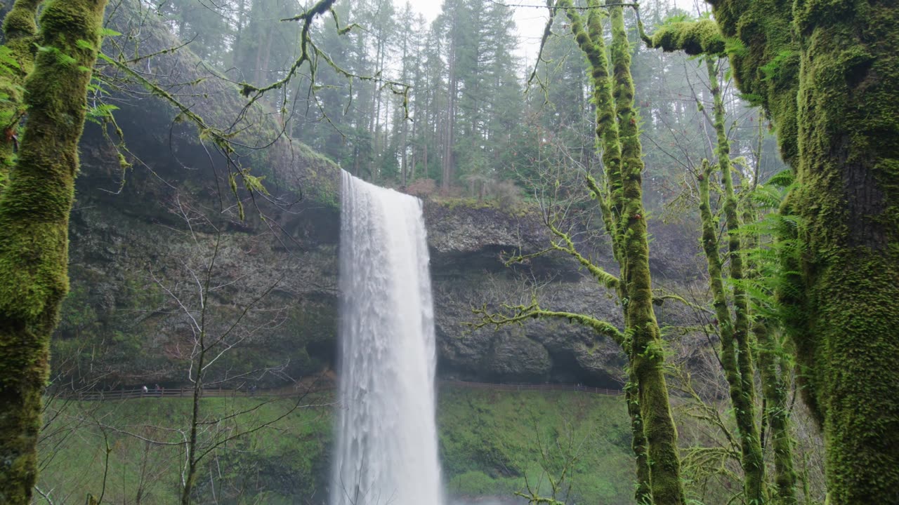 WATER FALL BETWEEN THE MOUNTAIN