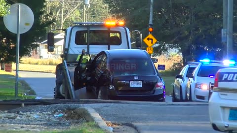 Car Towed Away After Crashing into Moving Train