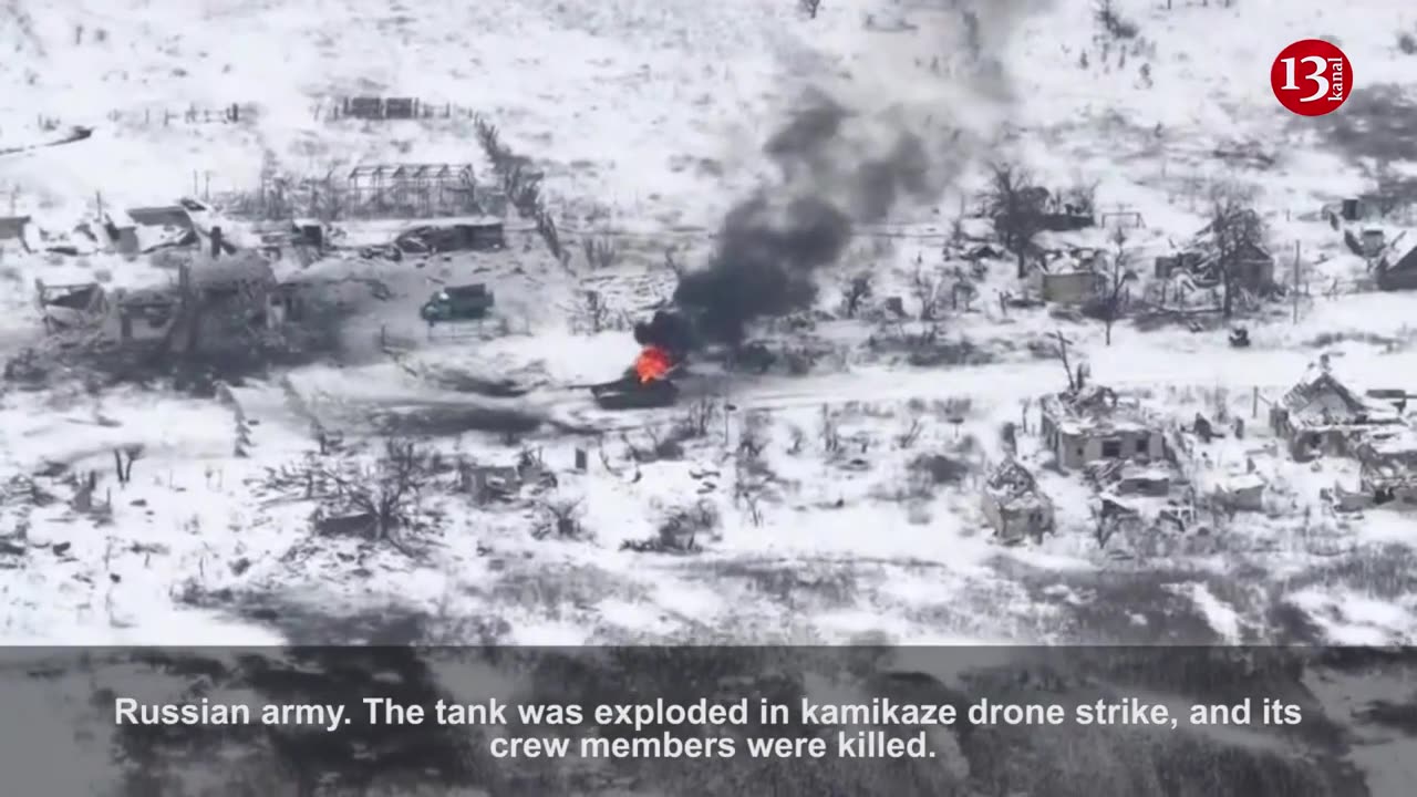 Image of a Russian tank burning in a snowy area after being defeated by a drone