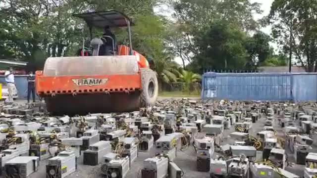 Watch: Malaysian Police Destroy Bitcoin Mining Rigs Worth Crores Using Steamroller