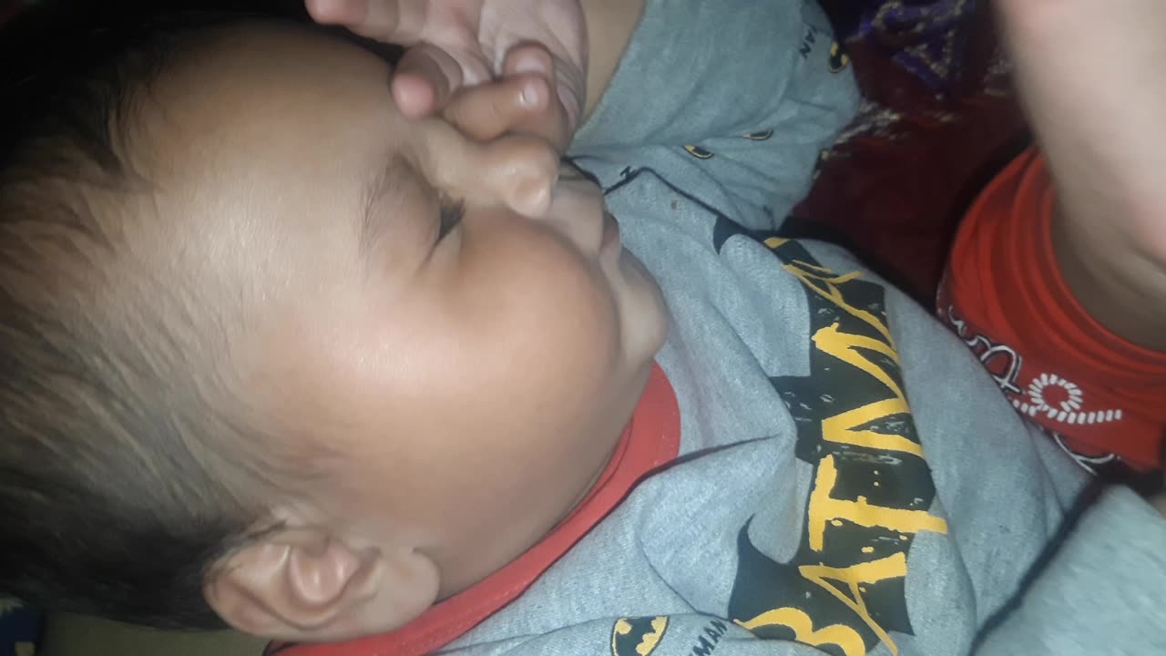 Playing with his own foot