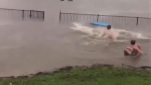 Kids Attempt to Jump Over Rail Half Submerged Under Water While Surfing