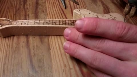 Woodburning a guitar