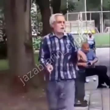 Happy man dancing in a park