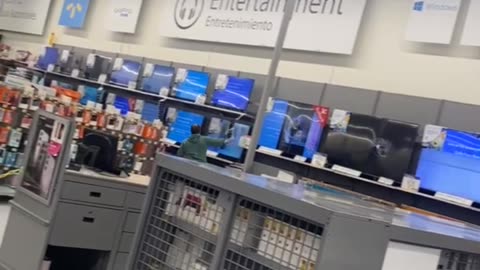 Man Smashes Display TVs
