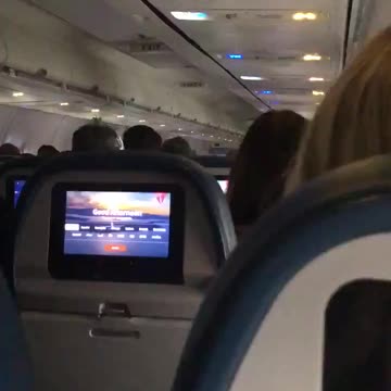 Mitt Romney, in a flight full of patriots in their way to DC