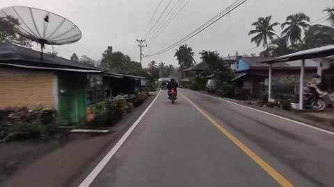 travel by motorbike along the streets of West Sumatra