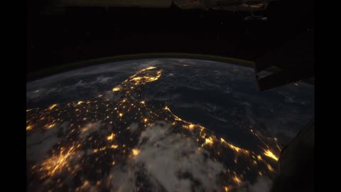 All alone in the night time lapse footage of the earth ad seen from the iss