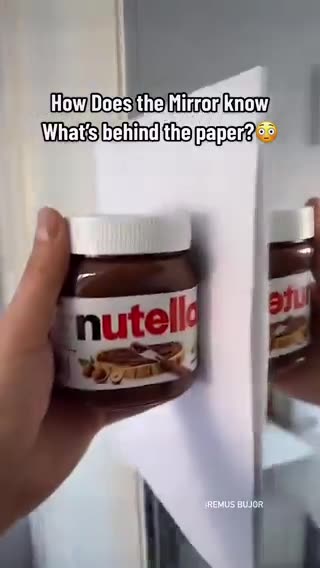 How does a mirror reflect something if it's behind a paper?