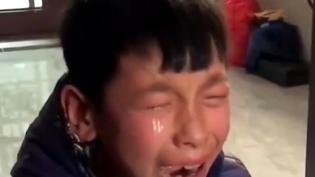 Chinese schoolboy bursts into tears of joy after achieving higher mark in exam