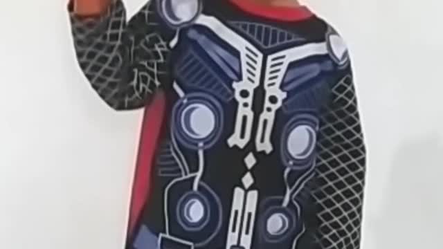 This little boy is so happy with his new costume