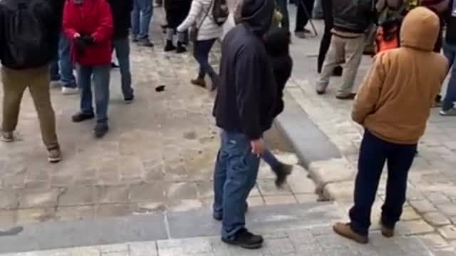 A Pro-Trump MAGA demonstrator ask Capitol Police to intervene against violent instigators