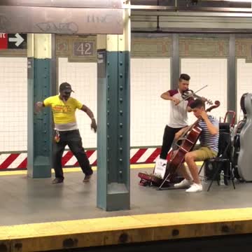 Man in yellow dances to classical music
