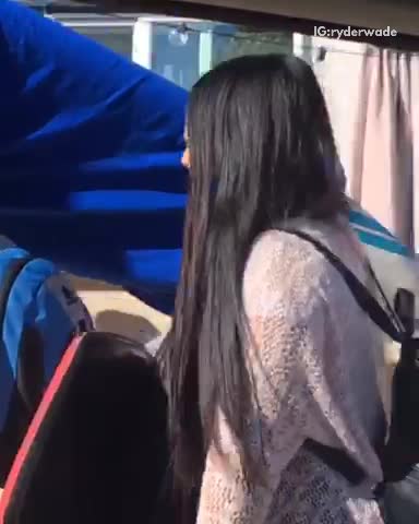 Surf board wrapped in blue tarp