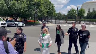 AOC Pretends to be Handcuffed at Squad Protest Outside SCOTUS