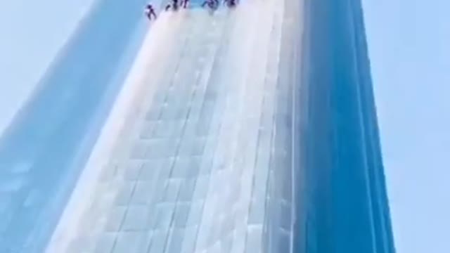 Cleaning a skyscraper after a dust storm Dubai