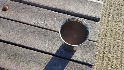 Coffee time at a beach on a sunny cold day.