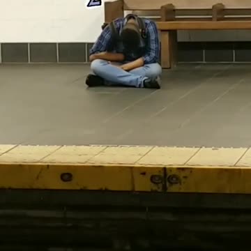 Blue flannel subway station sitting face down