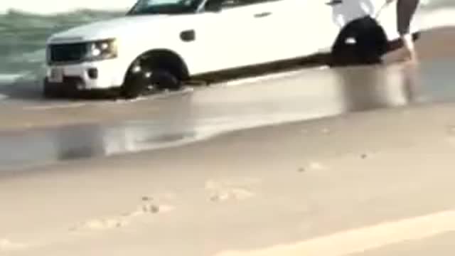 Land Rover Swamped on the Beach