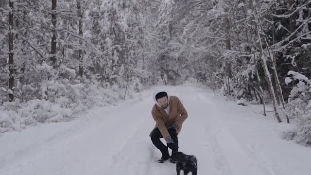 Man with a Dog in the Forest