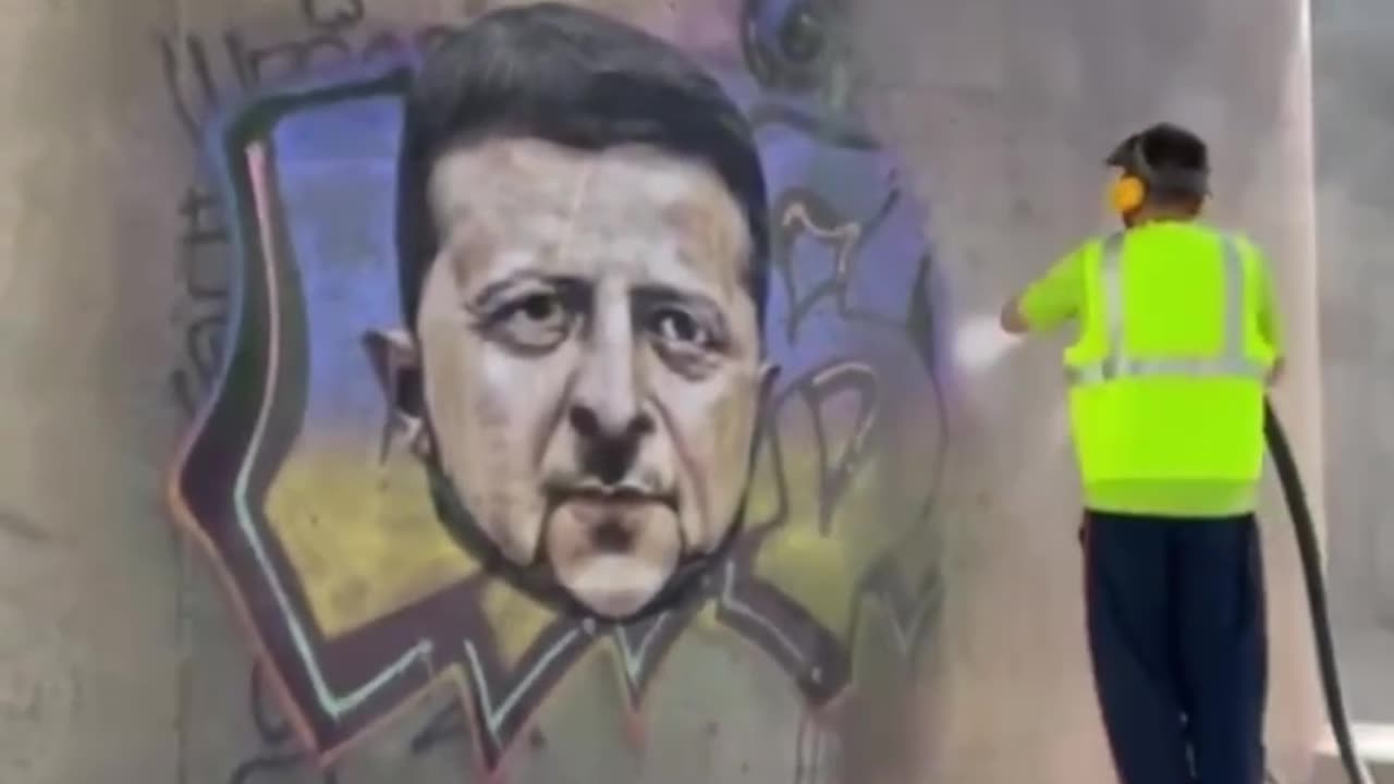 In Barcelona, ​​utility workers are washing away graffiti depicting Zelensky